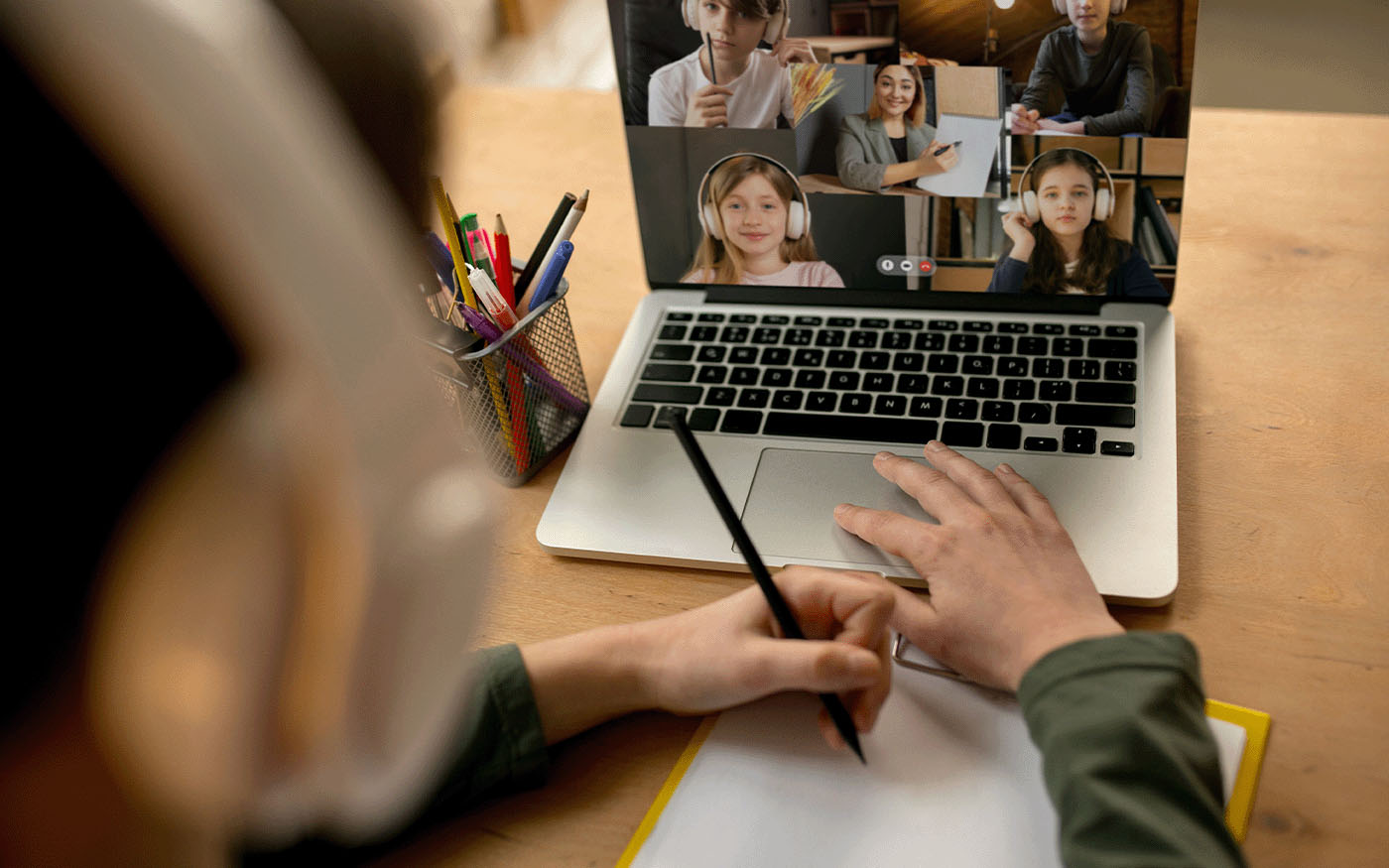 Young boy studying by video conference with teacher. Using stationery, notebook. Easy, comfortable usage concept, education, online, childhood.